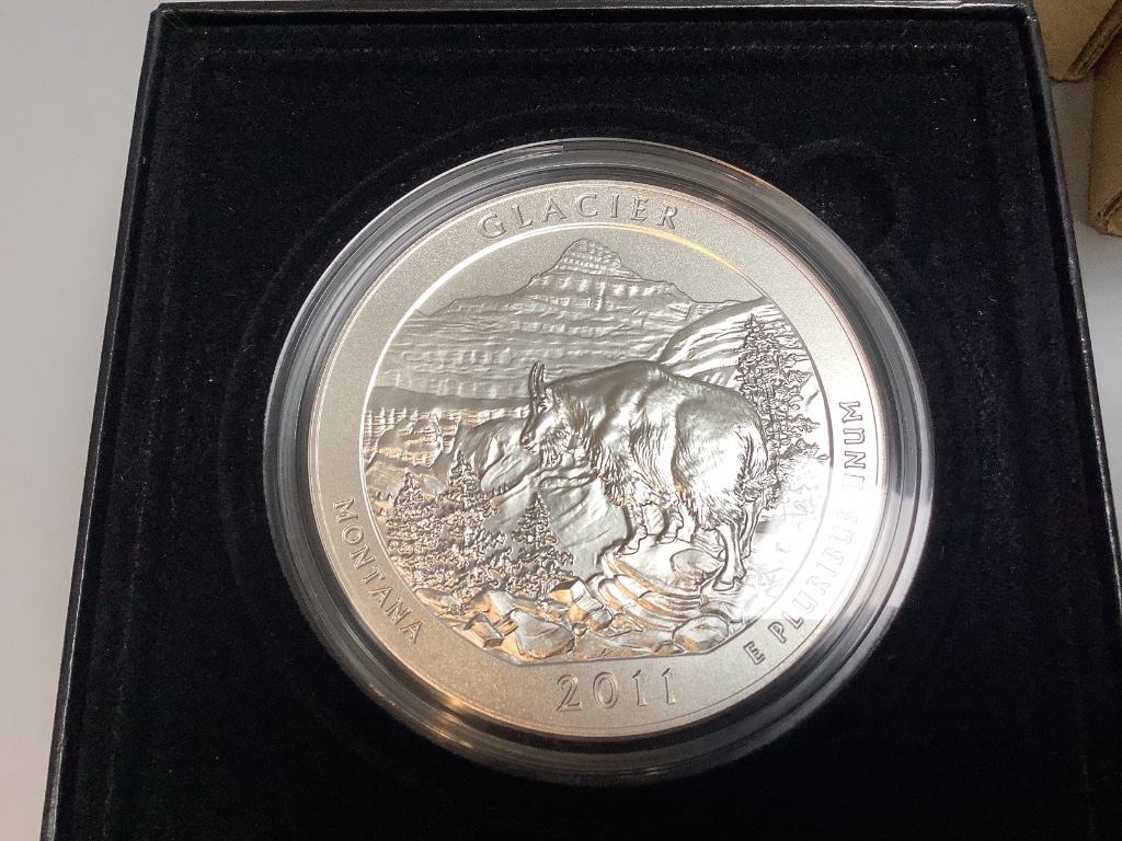 Nine Royal Canadian mint coins, including 6 silver $3 dollars, three United States mint 5 ounce silver coins and other US Mint coins (2 trays)